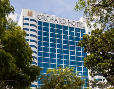 Tall building with blue-tinted windows, labeled 
