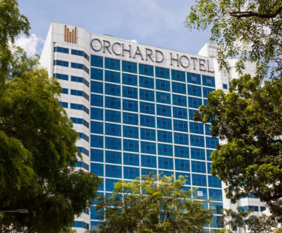 Tall building with blue-tinted windows, labeled 
