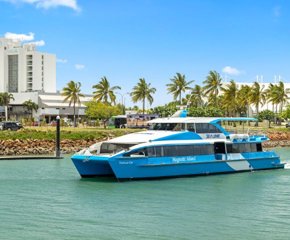 A blue and white ferry labeled 