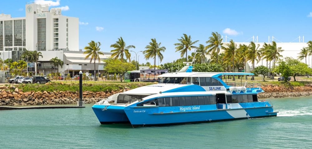 A blue and white ferry labeled 