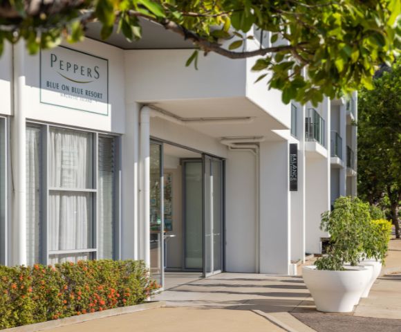 Modern resort entrance labeled 