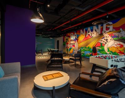 Modern lounge with colorful mural reading 