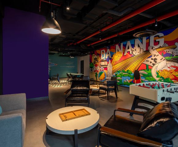 Modern lounge with colorful mural reading 