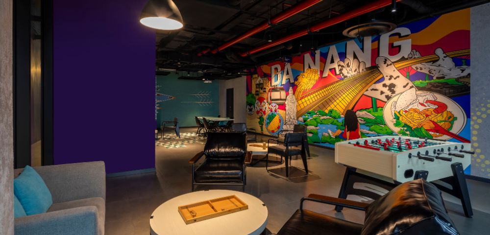 Modern lounge with colorful mural reading 