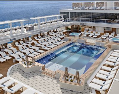 Luxurious cruise ship deck with elegant pool surrounded by numerous white lounge chairs. Calm ocean in the background, conveying relaxation and leisure.