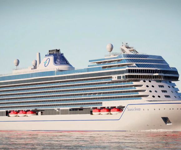Massive cruise ship sails peacefully, reflecting on calm waters. The modern design features multiple decks, lifeboats, and sleek lines against a clear sky.