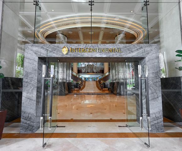 Glass entrance of a luxury hotel with 