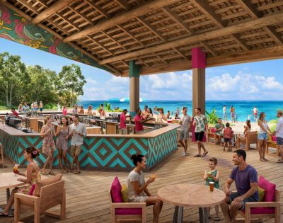 A vibrant beachside bar with people enjoying drinks under a colorful, open wooden roof. Clear blue sky and ocean in the background convey a relaxed, tropical mood.