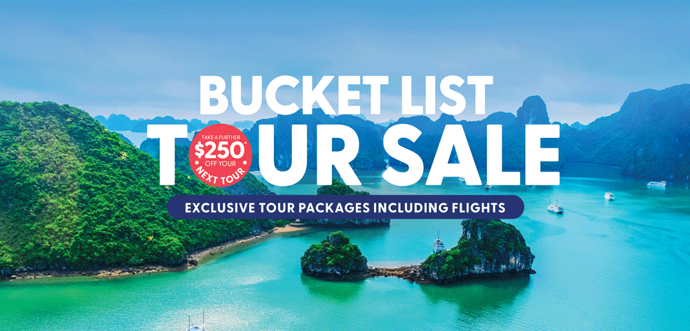 A scenic tropical bay with green islands and turquoise water promoting a bucket list tour sale.