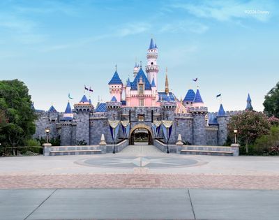 Beautiful stunning day at Disney with the castle, blue skies and fluffy white clouds