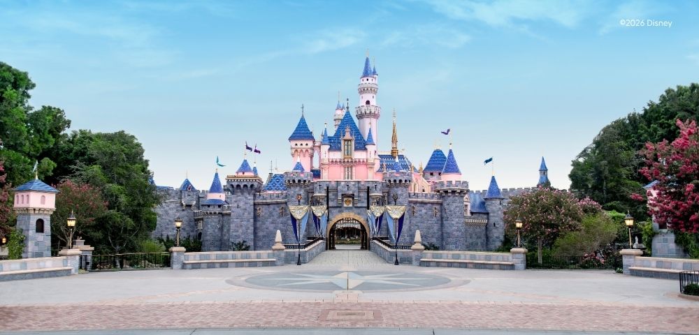 Beautiful stunning day at Disney with the castle, blue skies and fluffy white clouds