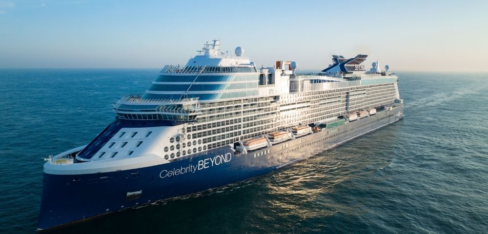 A large, modern cruise ship named 