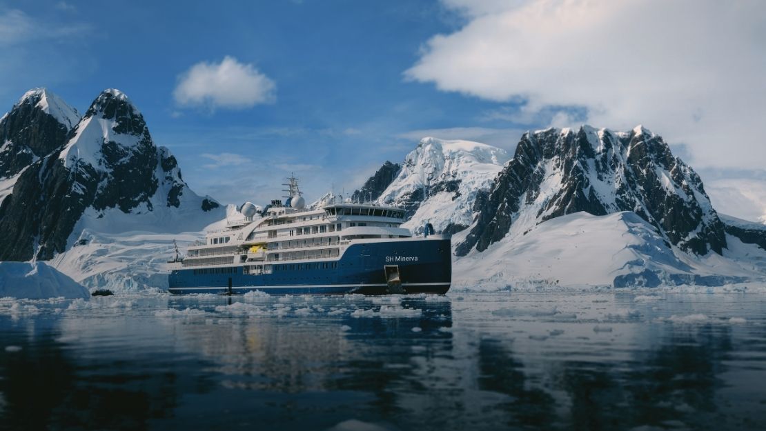 A blue and white expedition cruise ship named 