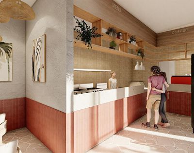 Interior view of a modern cafe with a counter, shelves displaying plants, and two customers standing near the counter.