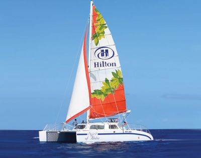 A white catamaran sailboat named 