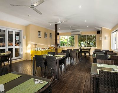 Indoor dining room with neatly arranged tables and chairs