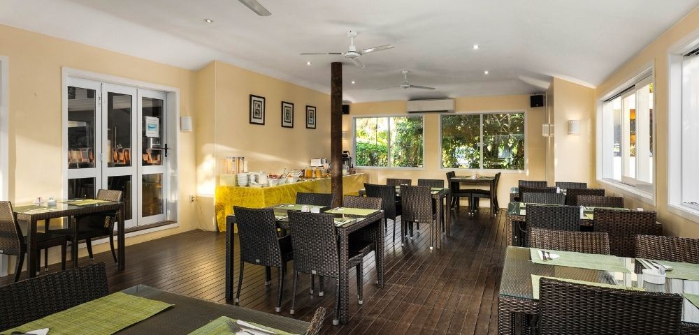 Indoor dining room with neatly arranged tables and chairs