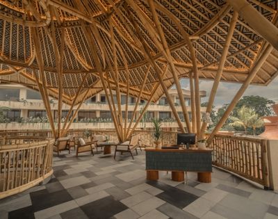 Resort lobby with bamboo-inspired architecture, open-air design, and contemporary seating