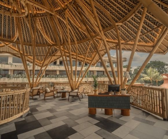 Resort lobby with bamboo-inspired architecture, open-air design, and contemporary seating