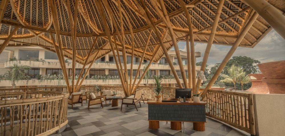 Resort lobby with bamboo-inspired architecture, open-air design, and contemporary seating