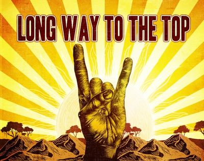 Rock hand gesture in front of a sunburst with the text 