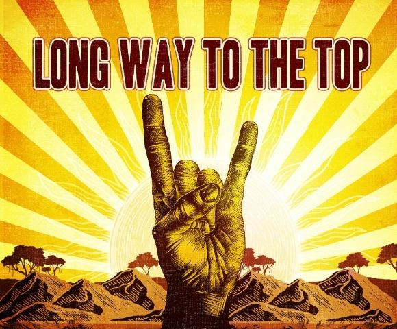 Rock hand gesture in front of a sunburst with the text 