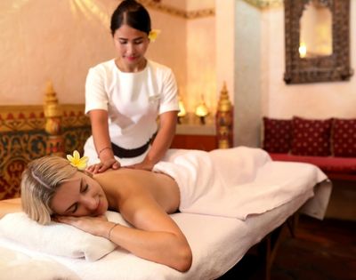 Signature Balinese massage treatment performed in an elegant spa treatment room at Prana Spa Bali