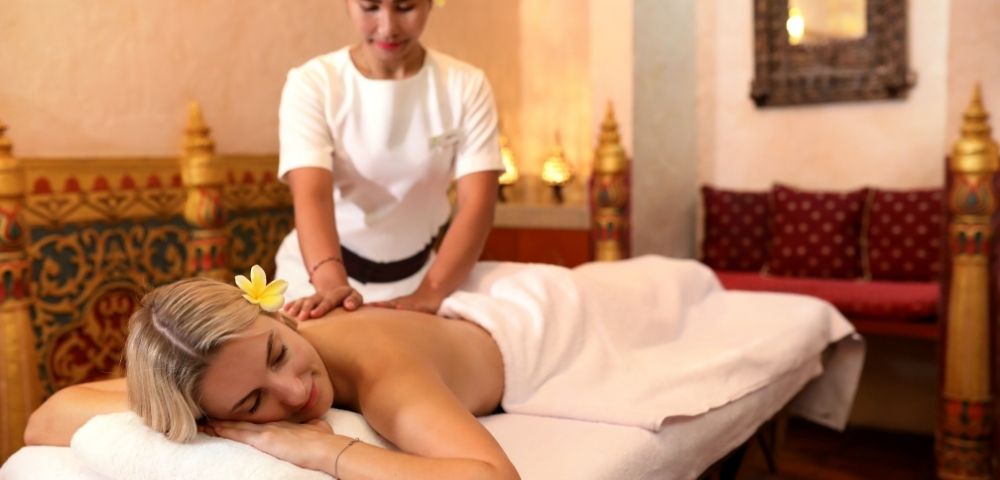 Signature Balinese massage treatment performed in an elegant spa treatment room at Prana Spa Bali