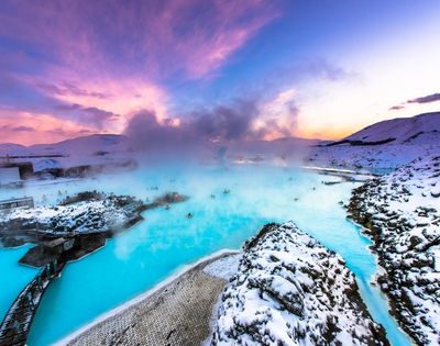 A scenic view of the Blue Lagoon in Iceland, showcasing its striking blue waters and natural volcanic landscape.