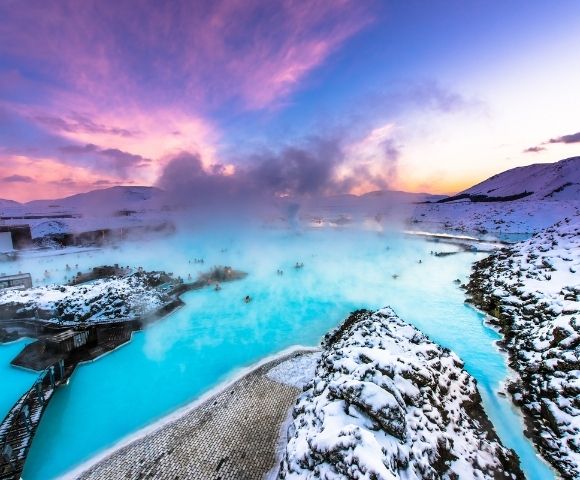 A scenic view of the Blue Lagoon in Iceland, showcasing its striking blue waters and natural volcanic landscape.