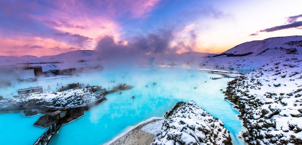 A scenic view of the Blue Lagoon in Iceland, showcasing its striking blue waters and natural volcanic landscape.