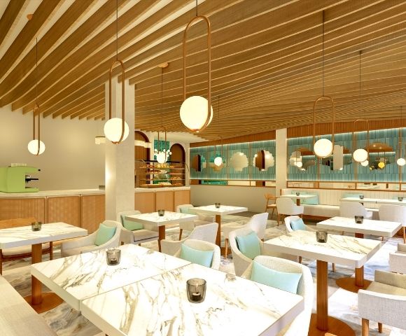 Modern cafe interior with marble tables, light blue and beige chairs, wooden ceiling beams, and round pendant lights.