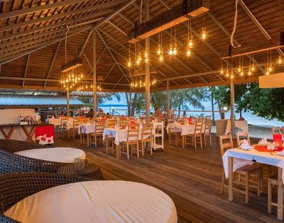 Open-air restaurant with wooden architecture and traditional Thai design