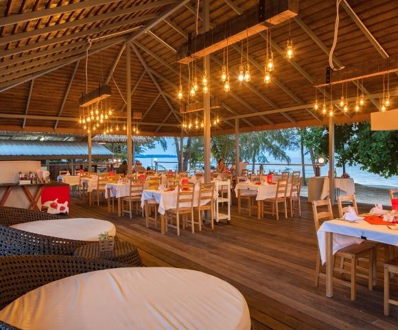 Open-air restaurant with wooden architecture and traditional Thai design