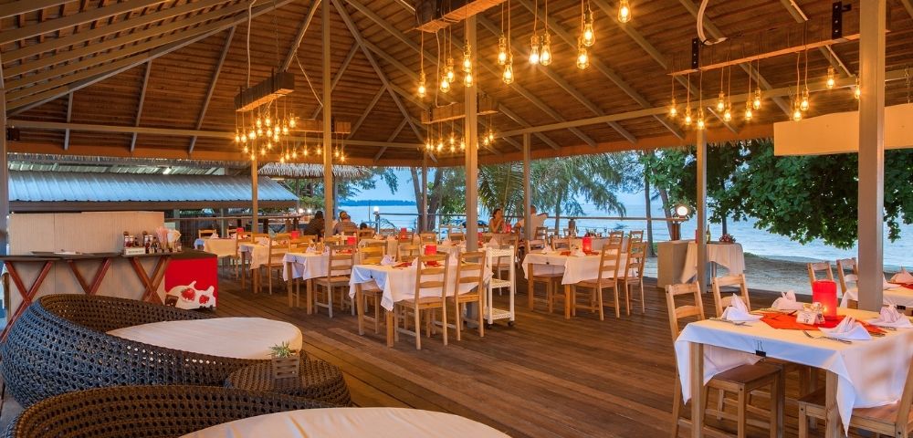 Open-air restaurant with wooden architecture and traditional Thai design