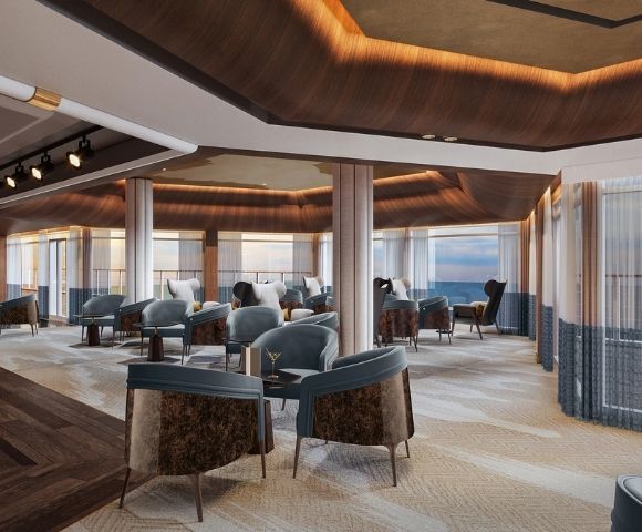 Luxurious lounge area with plush seating, a bar, and panoramic ocean views through floor-to-ceiling windows.