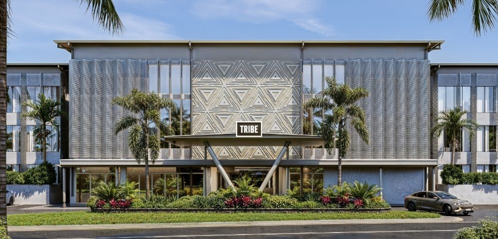 Modern building entrance with a triangular geometric pattern on the facade, a 