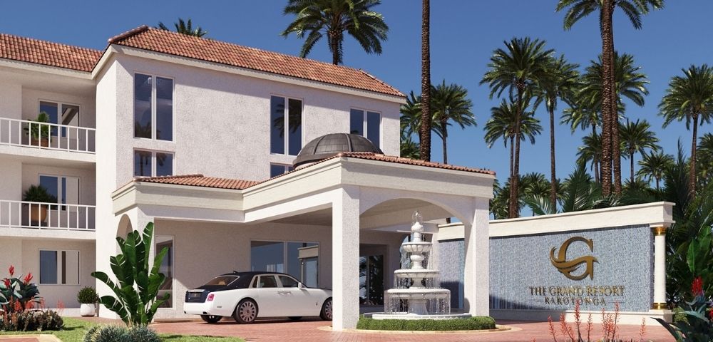 A white luxury sedan is parked at the entrance of a modern resort with palm trees in the background.