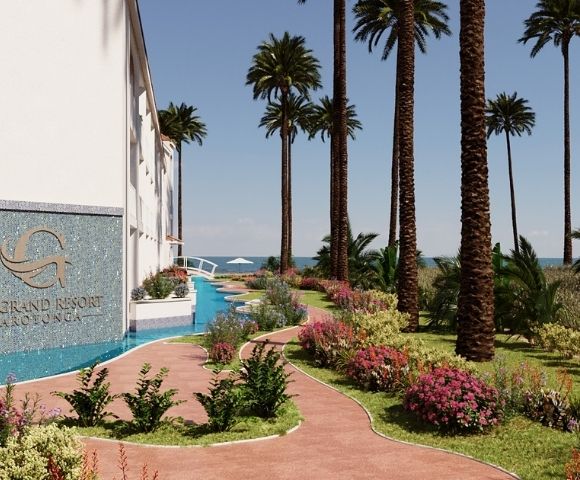 A resort building with a mosaic facade displaying a 