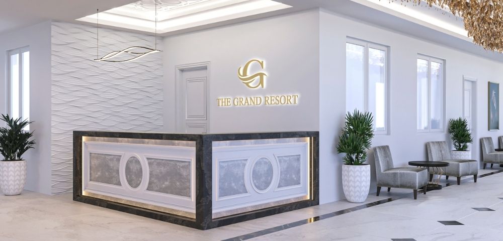A sleek, modern reception area with a curved front desk featuring decorative paneling and ambient lighting, a textured wave-patterned wall, and the 